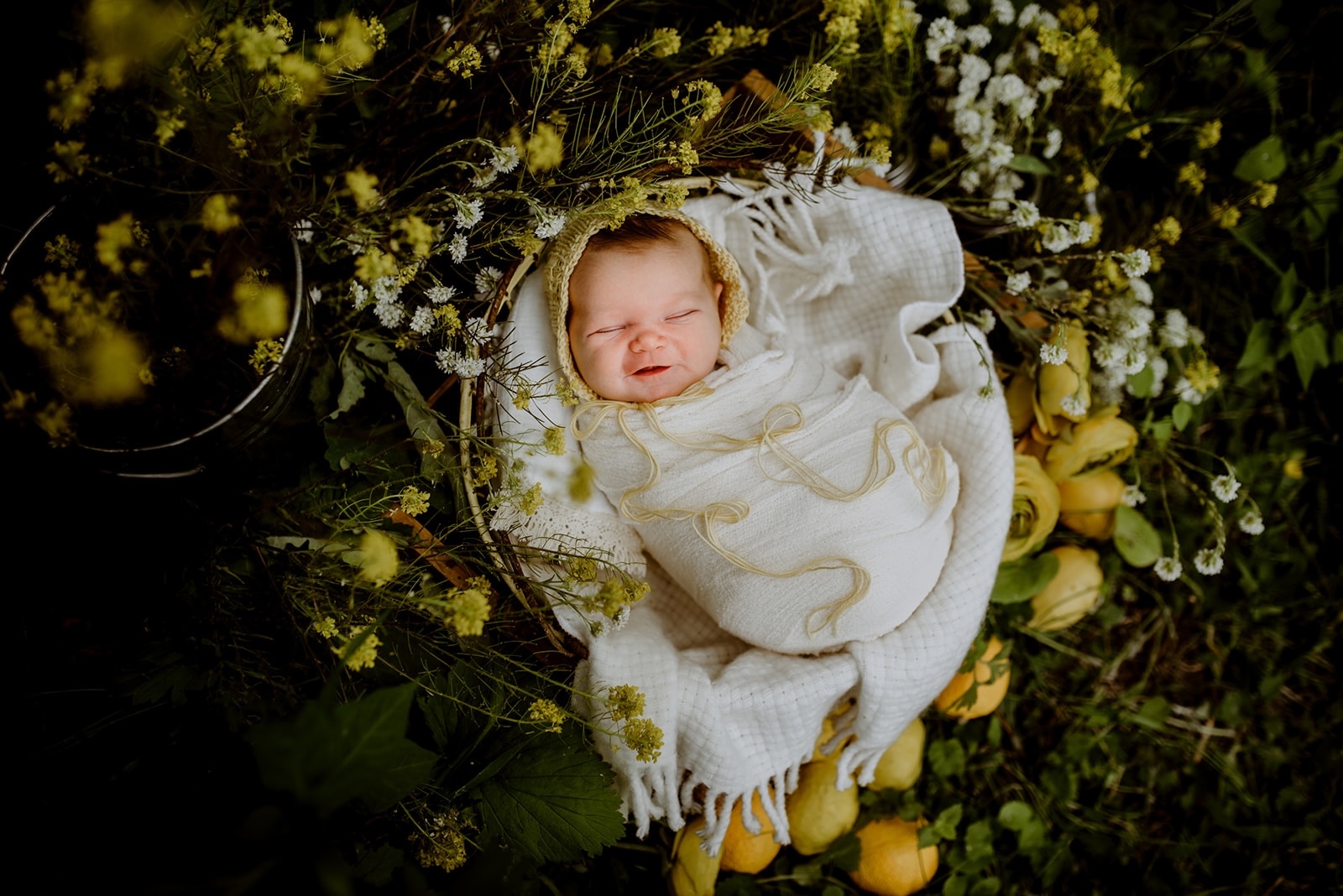 grinning newborn yellow flowers